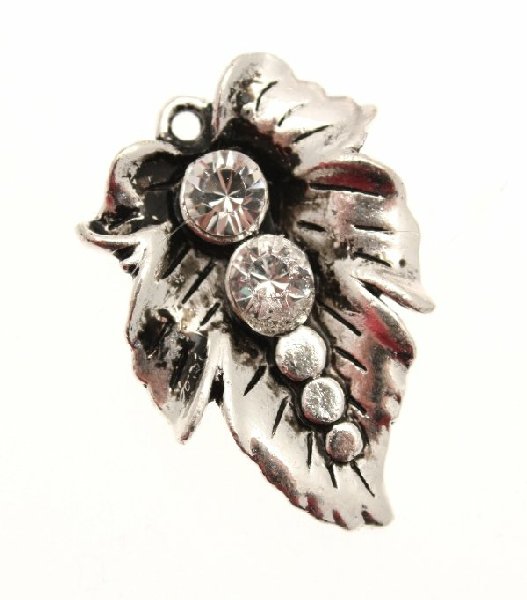 Ciondolo a forma di foglia piena con 2 strass crystal 25x35 mm.
