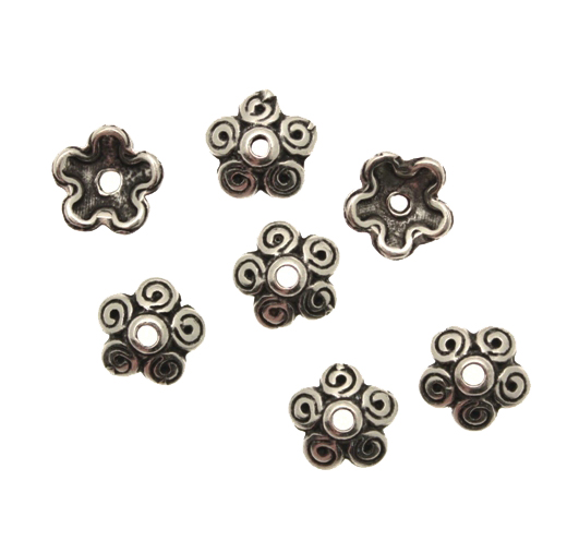 Coppetta tonda a fiore con petali dal disegno a spirale, diametro 10 mm.